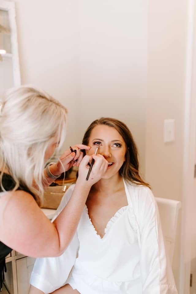 Catherine applying makeup during a lesson